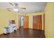This bright bedroom has wood-look flooring, ample closet space, and a vanity at 283 Haverclub Ct, Longwood, FL 32779