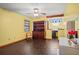 This bonus room is brightly painted and features dark wood-look flooring at 283 Haverclub Ct, Longwood, FL 32779