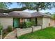 Charming home featuring a vibrant front door, brick accents, and lush landscaping at 283 Haverclub Ct, Longwood, FL 32779
