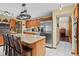Well-appointed kitchen with granite countertops, stainless appliances, and a spacious island with barstool seating at 283 Haverclub Ct, Longwood, FL 32779