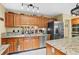Spacious kitchen featuring granite countertops, stainless steel appliances, and ample storage at 283 Haverclub Ct, Longwood, FL 32779