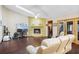 Spacious living room featuring a unique brick fireplace, vaulted ceilings, and comfortable seating arrangement at 283 Haverclub Ct, Longwood, FL 32779