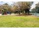 Community playground featuring a colorful slide, swings and a verdant lawn at 283 Haverclub Ct, Longwood, FL 32779