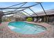 Inviting screened-in pool area, complete with patio seating and lush landscaping for a private oasis at 283 Haverclub Ct, Longwood, FL 32779