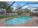 Screened-in pool with safety fence and brick patio, perfect for outdoor relaxation and entertainment at 283 Haverclub Ct, Longwood, FL 32779