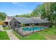 Screened pool with basketball hoop in a spacious enclosure for year-round outdoor enjoyment at 283 Haverclub Ct, Longwood, FL 32779