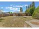 Spacious backyard featuring a fire pit and mature trees at 2838 Maldive Ct, Deltona, FL 32738