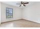 Bedroom with tile flooring, a ceiling fan, and a window overlooking the outdoors at 2838 Maldive Ct, Deltona, FL 32738