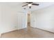 Bright bedroom with tiled floors, a ceiling fan, and access to the closet and bathroom at 2838 Maldive Ct, Deltona, FL 32738