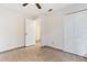 Bright bedroom featuring tile floors, ceiling fan, and closet space at 2838 Maldive Ct, Deltona, FL 32738