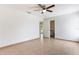 Neutral bedroom featuring tiled floors, a ceiling fan, and a closet at 2838 Maldive Ct, Deltona, FL 32738