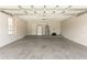 Spacious garage with ample storage space and access door to interior at 2838 Maldive Ct, Deltona, FL 32738