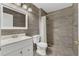 Stylish bathroom with tiled walk-in shower, neutral color palette, and updated vanity at 2935 Canoe Cir, St Cloud, FL 34772