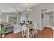 Open-concept living area with dining space, natural light, and access to the backyard at 2935 Canoe Cir, St Cloud, FL 34772