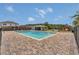 Community pool surrounded by brick pavers, with a cabana, playground, and adjacent residential buildings at 2935 Canoe Cir, St Cloud, FL 34772