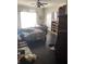 Spacious bedroom features hardwood floors, a ceiling fan, and built-in shelving for ample storage at 310 W Lake Ave, Auburndale, FL 33823