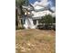 Charming two-story home with manicured landscaping and a welcoming front porch at 310 W Lake Ave, Auburndale, FL 33823