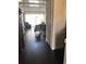 Hallway leads into living room with bright, natural light at 310 W Lake Ave, Auburndale, FL 33823
