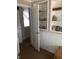 Hallway with shelving at 310 W Lake Ave, Auburndale, FL 33823