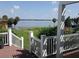 Scenic lake view from the property's deck featuring lush landscaping and waterfront access at 310 W Lake Ave, Auburndale, FL 33823
