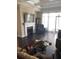 Cozy living room featuring a fireplace and lots of natural light at 310 W Lake Ave, Auburndale, FL 33823