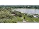 Expansive property with lake access, mature trees, and multiple outbuildings at 369 Bluff Lake Rd, Mascotte, FL 34753
