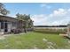 Spacious backyard with lush lawn, lake view, offering an ideal spot for outdoor activities and relaxation at 369 Bluff Lake Rd, Mascotte, FL 34753