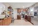 Well-organized kitchen featuring stainless steel appliances, dark wood cabinets, and laminate flooring at 369 Bluff Lake Rd, Mascotte, FL 34753