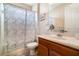 Bathroom featuring a sink, toilet, vanity, and decorative shower curtain with matching rug at 3896 Esplanade Ave, Port Orange, FL 32129