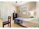 Bedroom featuring wood-look floors, a window, closet, and a bed with blue decorative blankets at 3896 Esplanade Ave, Port Orange, FL 32129