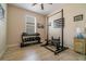 Exercise room with hardwood floors, free weights, workout bench, and natural light at 3896 Esplanade Ave, Port Orange, FL 32129