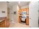 Functional kitchen with stainless steel appliances, wood cabinets, and tiled floor at 3896 Esplanade Ave, Port Orange, FL 32129