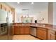 Bright kitchen features stainless steel appliances and a breakfast bar that opens to the living area at 3896 Esplanade Ave, Port Orange, FL 32129