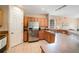 Well-lit kitchen features stainless steel appliances and ample cabinet storage at 3896 Esplanade Ave, Port Orange, FL 32129