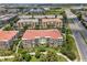 An aerial view of a multi-Gathering residence, nearby highway and roadways, and a large lake on the property at 4804 Cayview Ave # 20512, Orlando, FL 32819