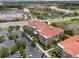 An aerial view of the multi-Gathering residences, parking lots, and lush green landscaping in the community at 4804 Cayview Ave # 20512, Orlando, FL 32819