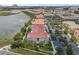 An aerial view of the multi-Gathering residences with lush landscaping and a nearby lake on the property at 4804 Cayview Ave # 20512, Orlando, FL 32819