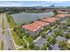 Aerial view of a multi-Gathering residence with a lake view and lush landscaping under a bright blue sky at 4804 Cayview Ave # 20512, Orlando, FL 32819