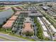 An aerial view of a multi-Gathering community with lush landscaping, nearby highways, and commercial areas at 4804 Cayview Ave # 20512, Orlando, FL 32819