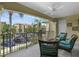 Relaxing balcony with comfortable seating and views of the parking area at 4804 Cayview Ave # 20512, Orlando, FL 32819
