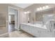 Bright bathroom featuring double vanities and tile flooring at 4804 Cayview Ave # 20512, Orlando, FL 32819