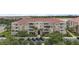 Beautiful building exterior with well maintained landscaping, parking, and a red tile roof at 4804 Cayview Ave # 20512, Orlando, FL 32819