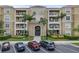 Inviting condo exterior with a well-maintained facade, lush landscaping, and convenient parking spaces at 4804 Cayview Ave # 20512, Orlando, FL 32819
