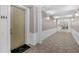 Hallway featuring tiled floors, chair rail moulding, and neutral paint at 4804 Cayview Ave # 20512, Orlando, FL 32819