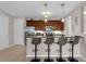 Modern kitchen featuring a breakfast bar, stainless steel appliances, and stylish bar stools at 4804 Cayview Ave # 20512, Orlando, FL 32819