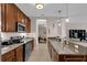 Well-appointed kitchen featuring stainless steel appliances, granite counters, and ample cabinet space at 4804 Cayview Ave # 20512, Orlando, FL 32819