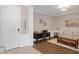 Inviting home office featuring hardwood floors, neutral walls, and comfortable seating at 4804 Cayview Ave # 20512, Orlando, FL 32819