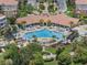 Resort-style pool and sunbathing deck at the condo community with lush landscaping and lounge seating at 4804 Cayview Ave # 20512, Orlando, FL 32819