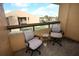 Balcony view featuring seating and a picturesque view of lawn and surrounding property at 5027 Vineland Rd # 5027, Orlando, FL 32811
