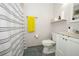 Bathroom with shower curtain and yellow towel at 5027 Vineland Rd # 5027, Orlando, FL 32811